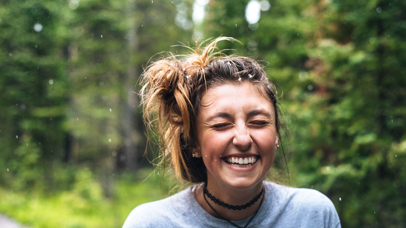 Smiling girl in forest